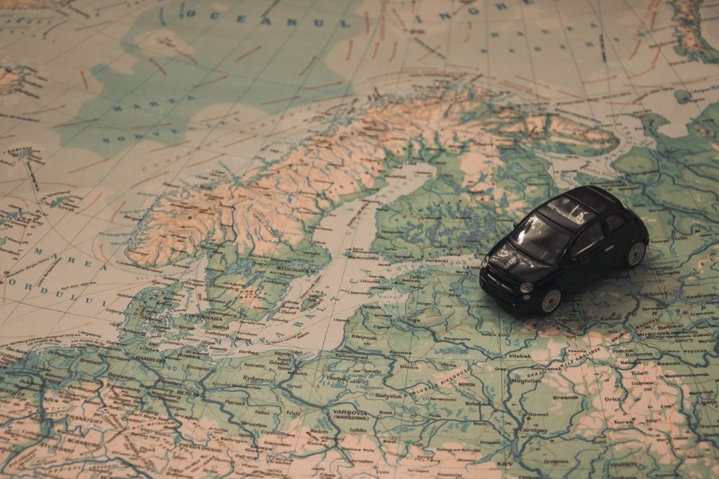 Can I register a car in a different state than I live in?
Image of a toy car on a map by Pexels from Pixabay
